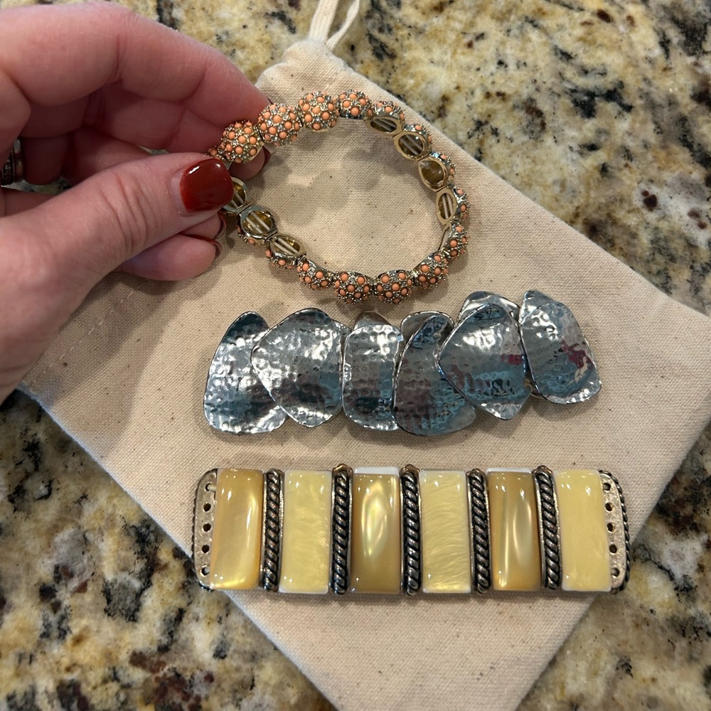 Holiday outfit stretch, Silver, Gold and coral bracelets.